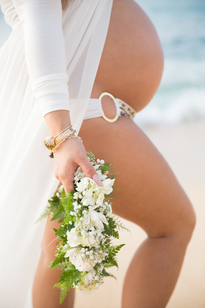 Maternity beach photo with flowers